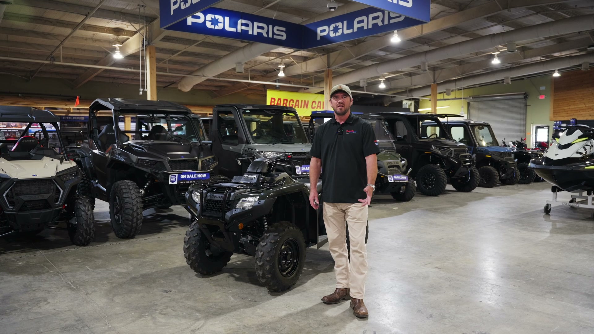 Hunter with a camo ATV in the field — Hunter Bundle from Friendly Powersports Slidell